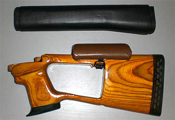 Custom wood stock with cheek pad